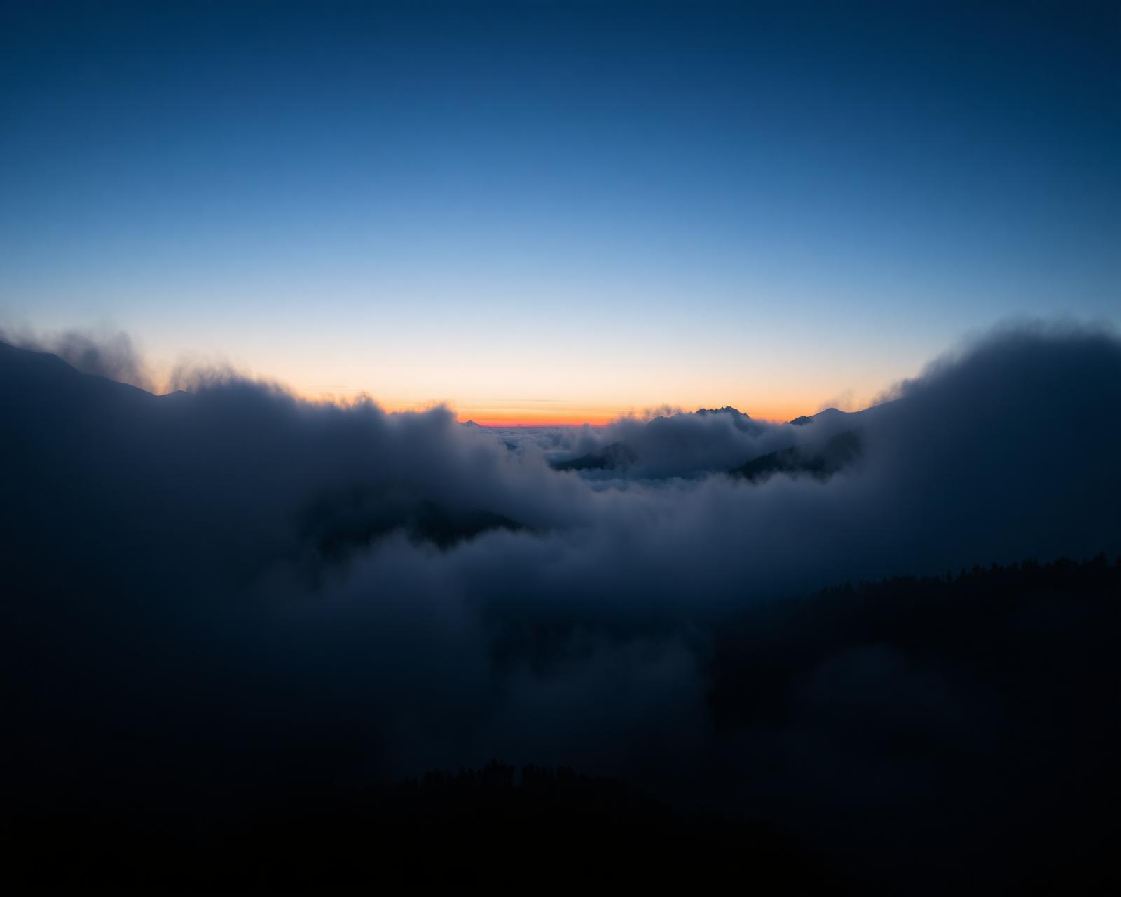 Mountain landscape at dawn with mist